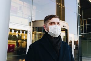 Man in a mask outside building, Platinum Resumes, Kansas City, MO