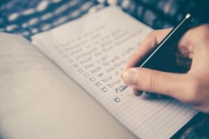 Person making a checklist with boxes, Platinum Resumes, Kansas City, MO